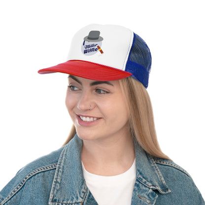 A smiling person with long hair and a nose ring wears the Miller Wiffel Ball ITYSL Driving Crooner Trucker Cap from Printify, which is white and pink and features a graphic of a hat, pipe, and "Miller Wiffle" text. The cap includes an adjustable snap closure for comfort. They are also wearing a blue denim jacket over a white shirt.