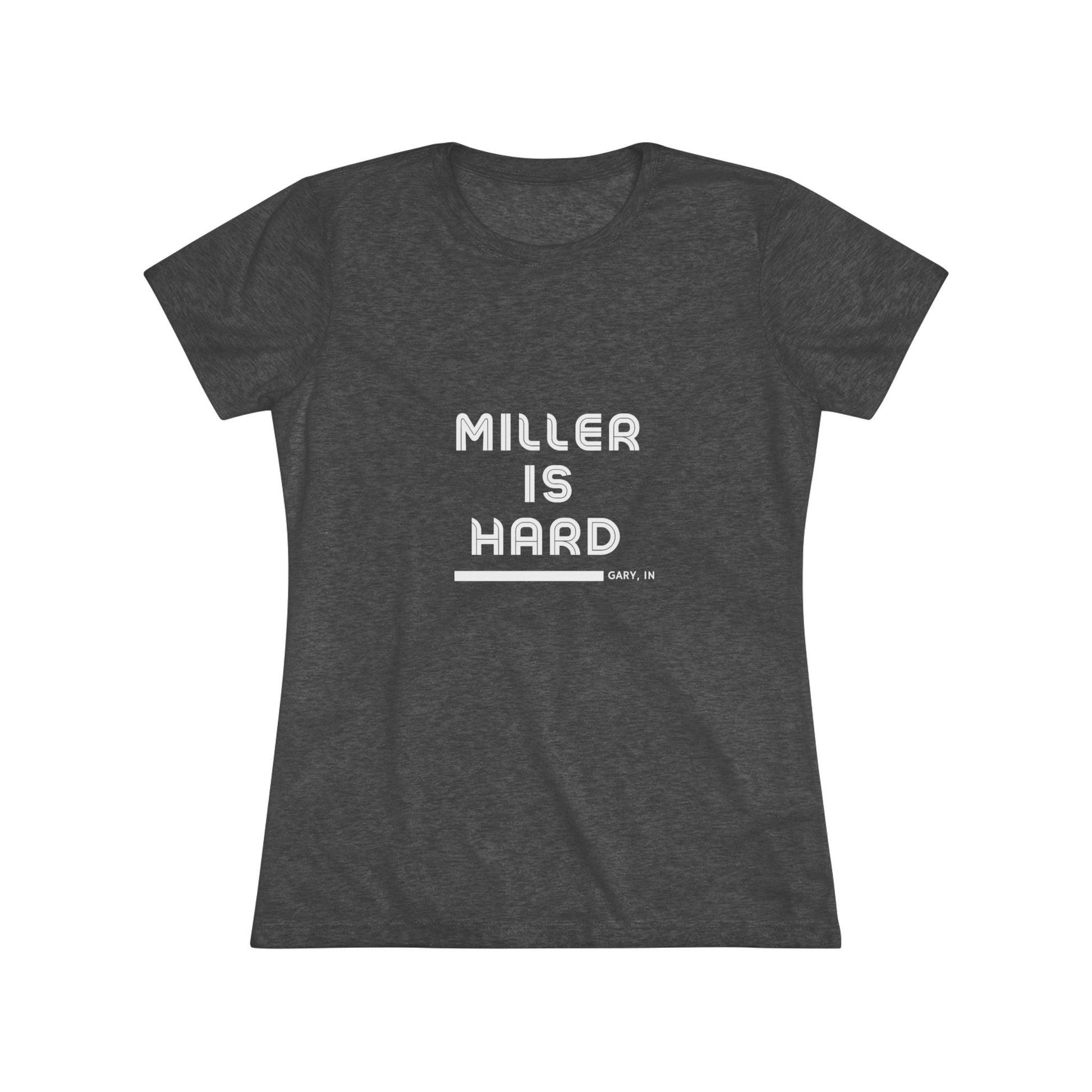 The Miller is Hard - Miller Beach Women's Triblend Tee by Printify features unique red coloring with white text that reads "MILLER IS HARD" and "GARY, IN" below, showcasing distinctive lettering spacing and alignment. Made from ultra-soft fabric, this shirt ensures a comfortable fit with a simple, casual design.