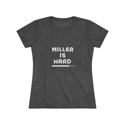 The Miller is Hard - Miller Beach Women's Triblend Tee by Printify features unique red coloring with white text that reads "MILLER IS HARD" and "GARY, IN" below, showcasing distinctive lettering spacing and alignment. Made from ultra-soft fabric, this shirt ensures a comfortable fit with a simple, casual design.