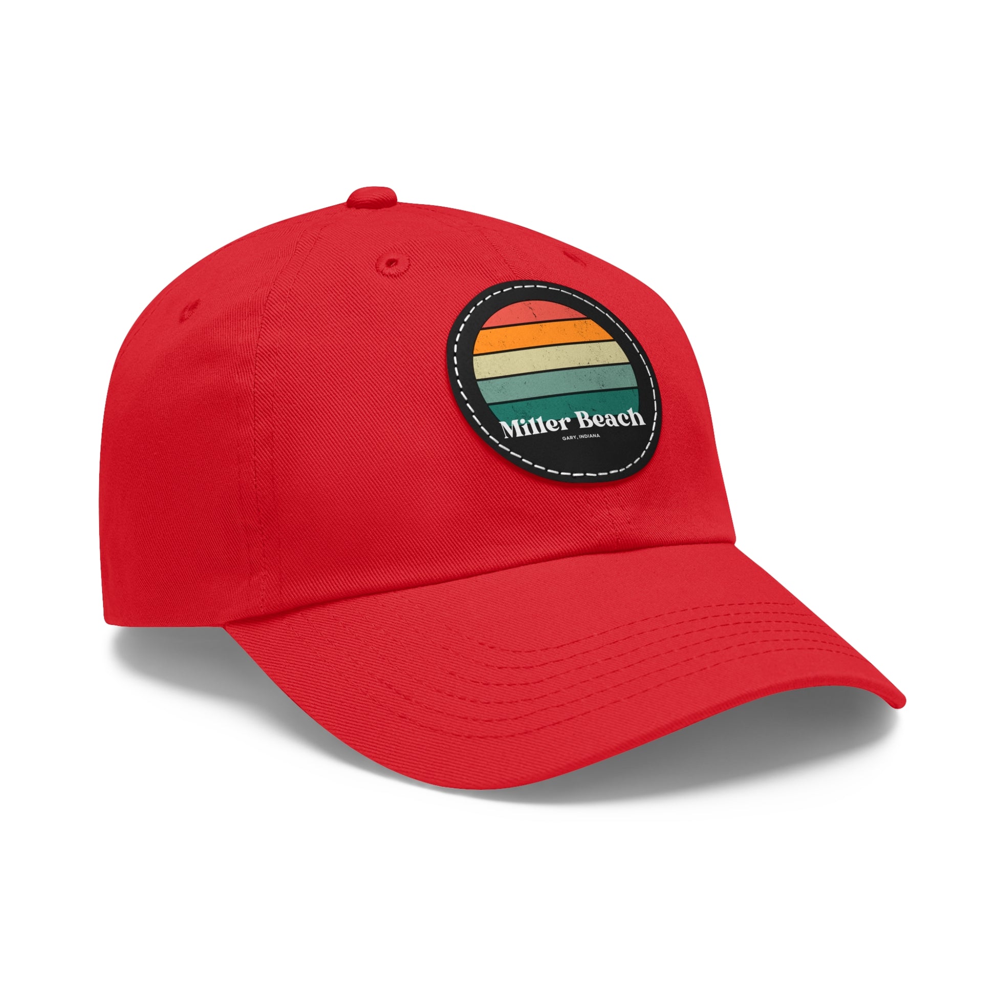 The Miller Beach Retro Sunset - Dad Hat with Leather Patch (Round) by Printify is a pink baseball cap crafted from bio-washed chino twill for added comfort. It features a PU leather patch adorned with horizontal stripes in red, orange, yellow, green, and blue. Below the stripes, "Miller Beach" is embroidered in white. An adjustable strap at the back ensures a perfect fit.