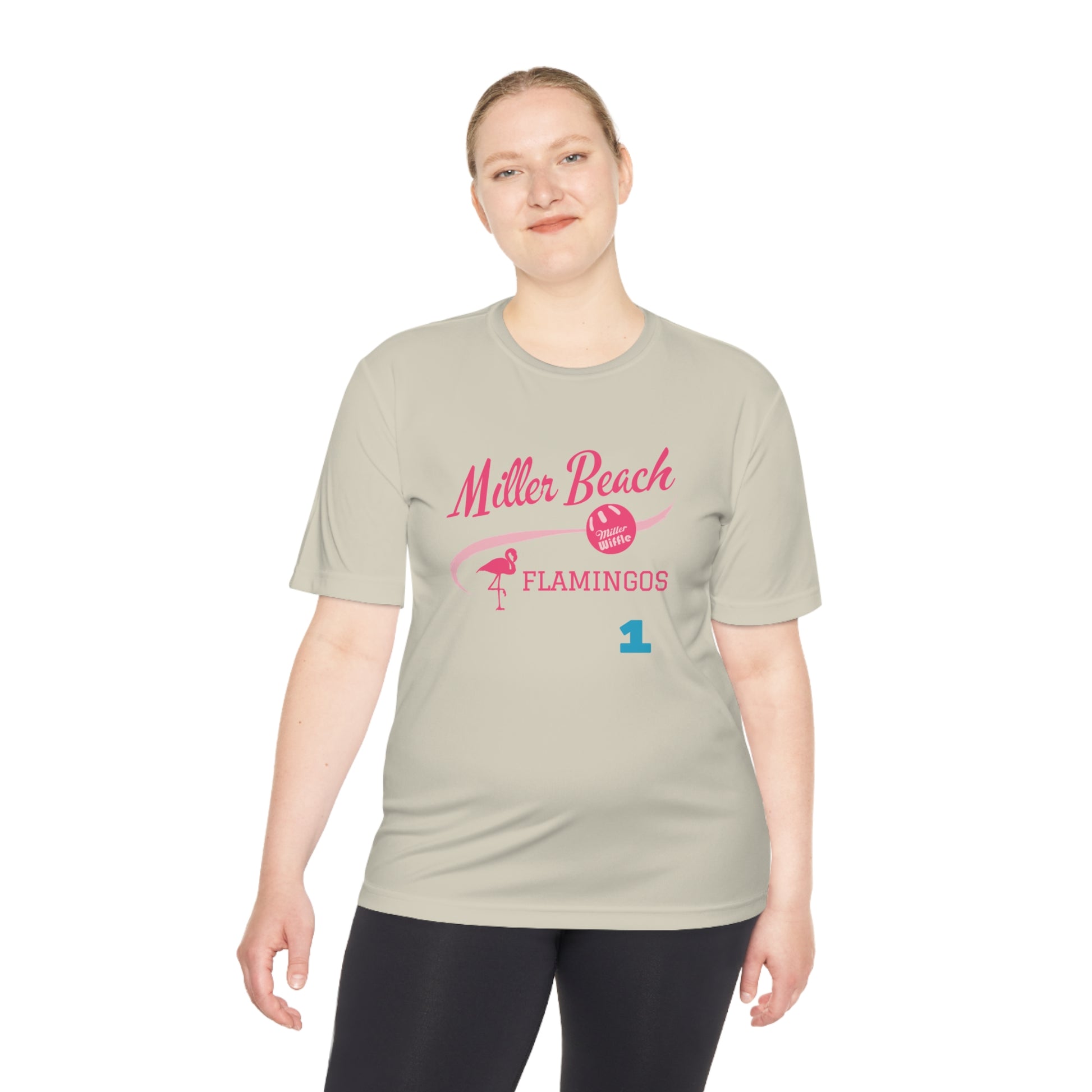 Introducing the "Miller Beach Flamingos - Jackson 01" Unisex Moisture Wicking Tee by Printify. This beige T-shirt showcases "Miller Beach" in a pink cursive font accompanied by a small pink flamingo illustration. Below, "FLAMINGOS" is displayed in bold pink capital letters, with a blue "01" on the bottom right corner. As part of the Sport-Tek PosiCharge Competitor collection, this lightweight shirt provides superior moisture-wicking performance.