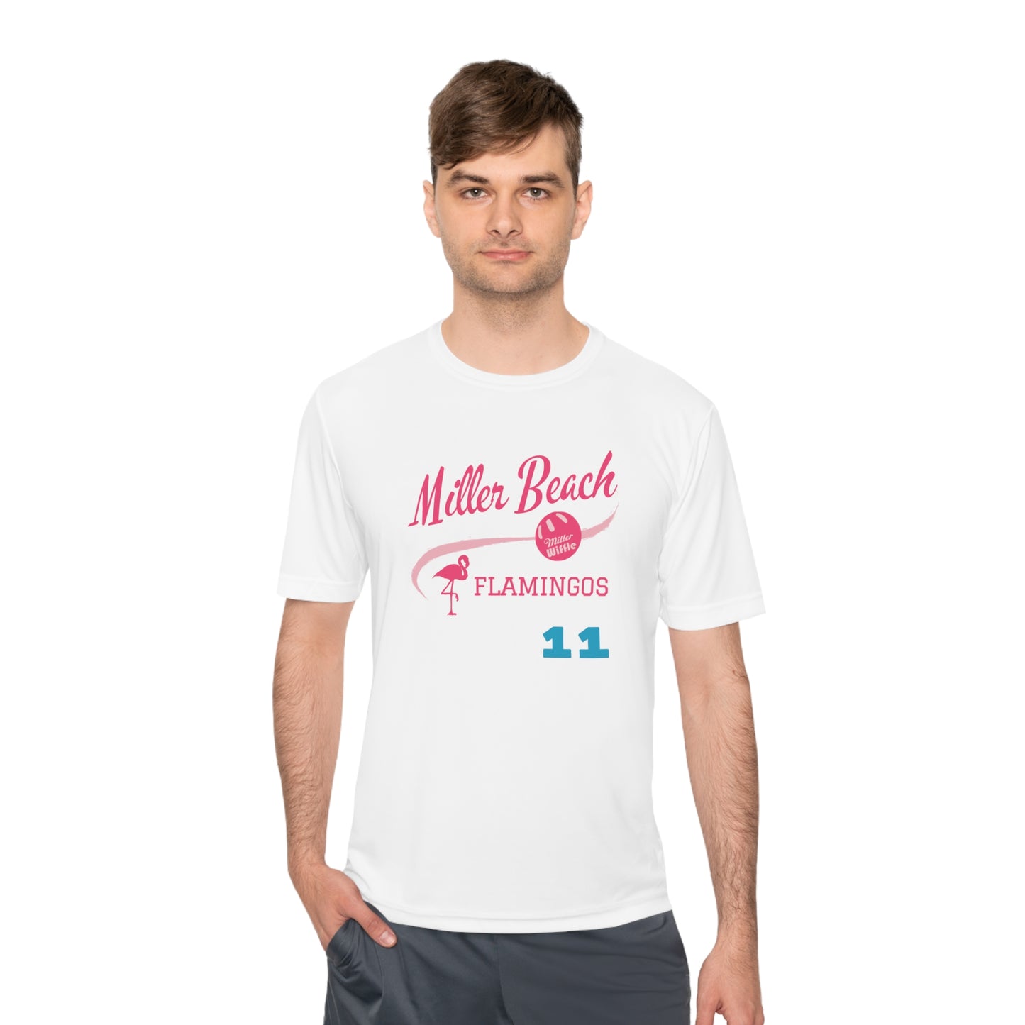 The Miller Beach Flamingos - Poncin 11 Unisex Moisture Wicking Tee by Printify features a beige shirt with "Miller Beach" in pink script, accompanied by a small illustration of a flamingo and volleyball. Below this design, the word "FLAMINGOS" is displayed in pink, with the number "11" appearing in blue near the bottom. Made from Sport-Tek PosiCharge Competitor Tee fabric, this custom moisture-wicking shirt ensures you stay cool and stylish.