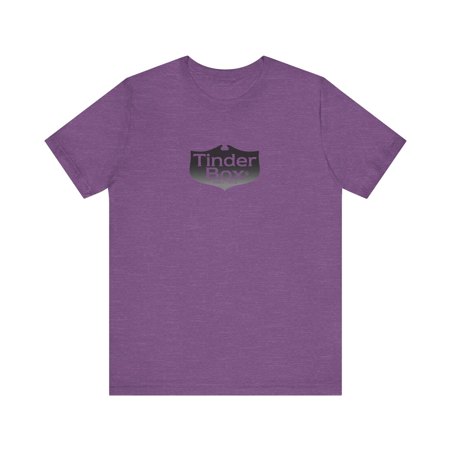 A light blue Printify "The Tinder Box 1980s" unisex jersey short sleeve tee featuring the "Tinder Box" logo in the center. The logo consists of a dark shield with the words "Tinder Box" in white text, with a small flame icon replacing the dot above the "i".