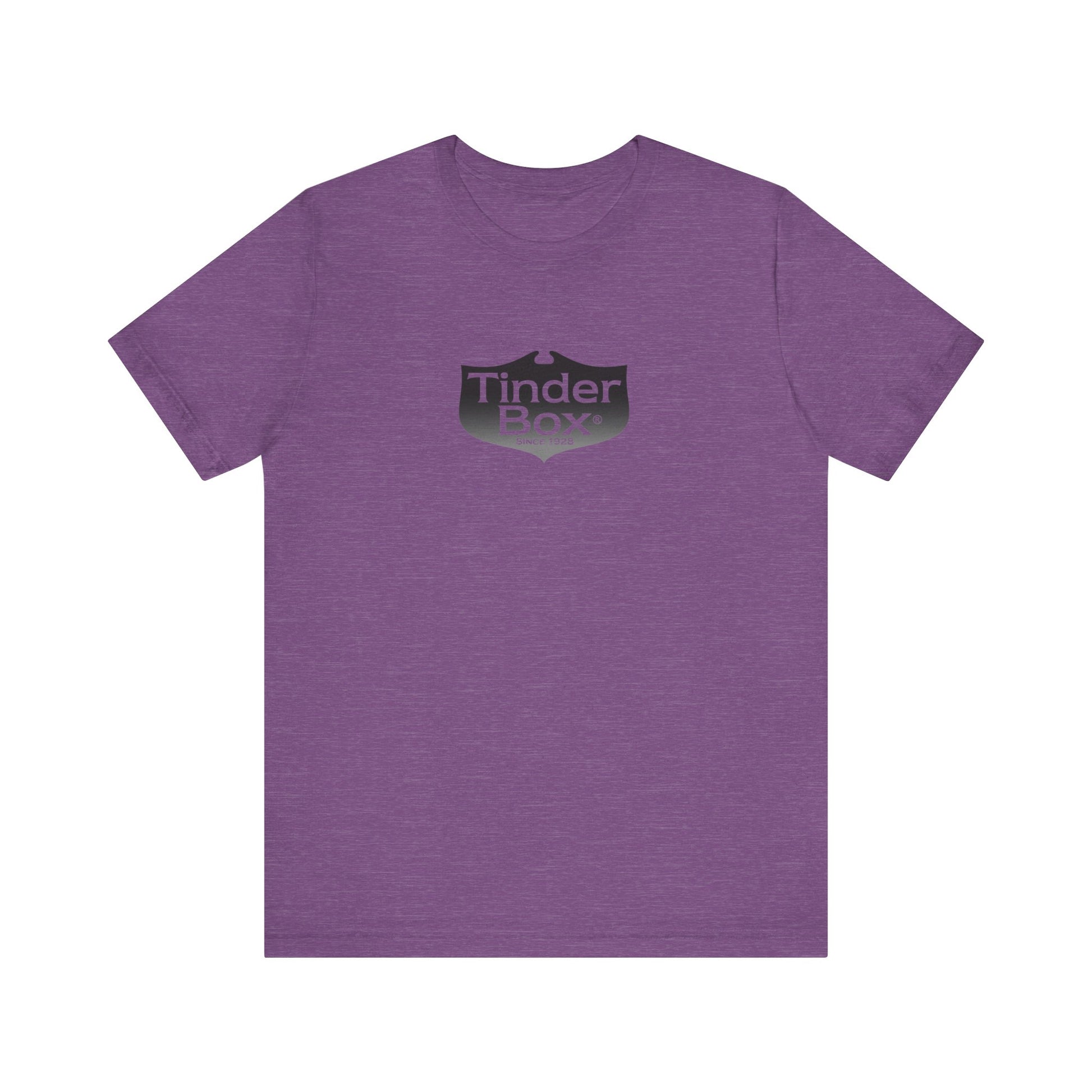 A light blue Printify "The Tinder Box 1980s" unisex jersey short sleeve tee featuring the "Tinder Box" logo in the center. The logo consists of a dark shield with the words "Tinder Box" in white text, with a small flame icon replacing the dot above the "i".