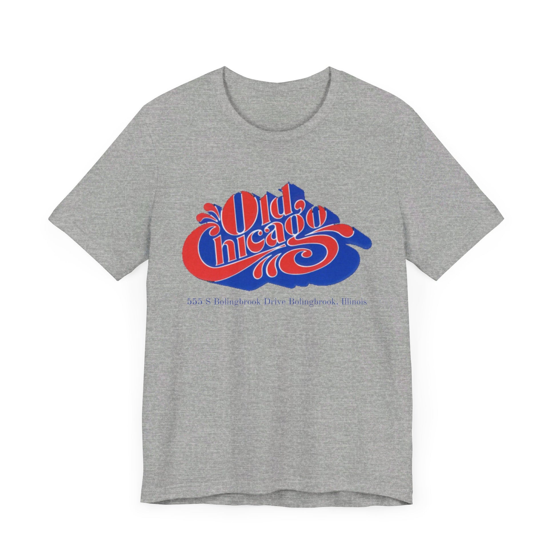 The "Old Chicago Mall Bolingbrook 1980s Retro - Unisex Jersey Short Sleeve Tee" from Printify is a gray T-shirt showcasing a vintage design with the text "Old Chicago" in blue and red. Beneath the main text, the address "355 S. Bolingbrook Drive, Bolingbrook, Illinois" appears in smaller font, evoking 80s nostalgia of the Old Chicago Mall. The shirt is displayed against a white background.