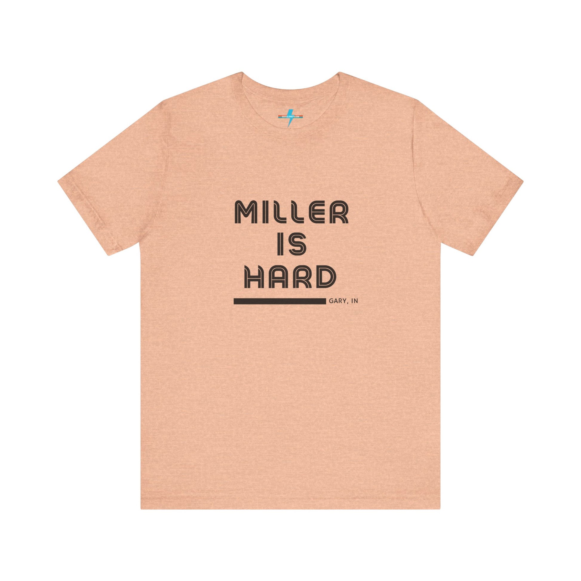 A unisex jersey short sleeve tee from Printify in burnt orange features the bold black text "MILLER IS HARD" on the chest, with "GARY, IN" written beneath in smaller black font. Perfect for showcasing Miller Beach's iconic spirit, this t-shirt is displayed against a plain white background.