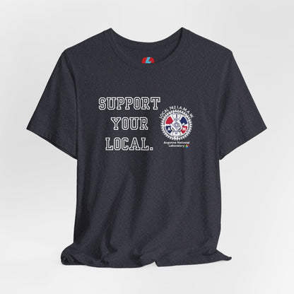 A blue unisex jersey short sleeve tee from Printify showcases the text "SUPPORT YOUR LOCAL" in bold white capital letters on the front. Additionally, it features a white and red graphic emblem for the Atomic Trades & Labor Council, AFL-CIO, Local 148 with "Argonne National Laboratory" text beneath it. Wear this Support Your Local - IAMAW 742 shirt to show your union solidarity.