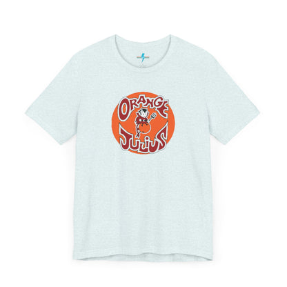 The Orange Julius 1980's Logo Unisex Jersey Style T-Shirt from Printify boasts a light gray color and features a vintage-style graphic. The design showcases the text "Orange Julius" in a stylized font within an orange circle, along with a small cartoon character holding a drink at the center—a nostalgic nod to timeless refreshment.