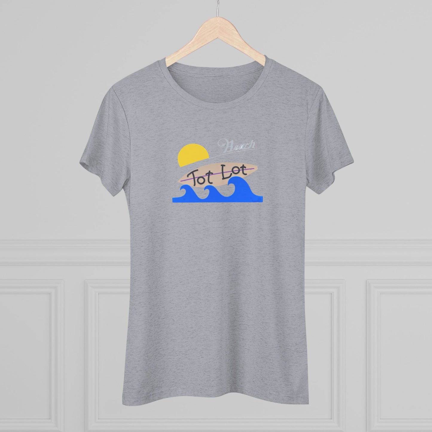 Introducing the Tot Lot Full Sign - Miller Beach - Women's Triblend Tee by Printify! This stylish gray t-shirt features a vintage-inspired design showcasing a setting sun, a surging blue wave, and the phrase "Miller Beach Tot Lot" in eye-catching stylized fonts. Perfect for any casual outing, this beach-themed top exudes a playful and trendy vibe.