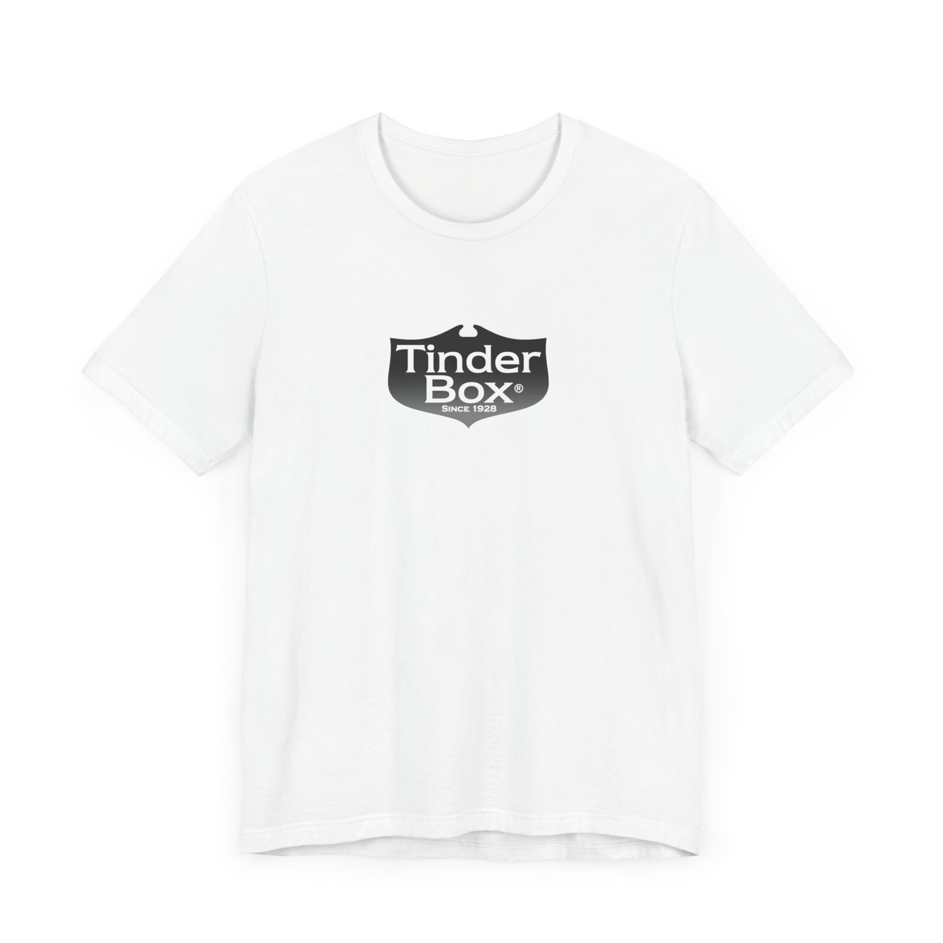 A light blue Printify "The Tinder Box 1980s" unisex jersey short sleeve tee featuring the "Tinder Box" logo in the center. The logo consists of a dark shield with the words "Tinder Box" in white text, with a small flame icon replacing the dot above the "i".