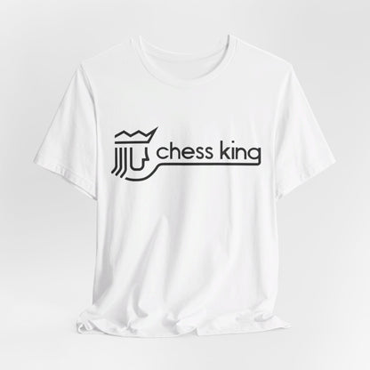 A unisex jersey short sleeve tee from Printify, featuring the Chess King 1980's Clothing Store Logo with a black, stylized king chess piece and the words "Chess King" on a blue background, reminiscent of retro 80s fashion.