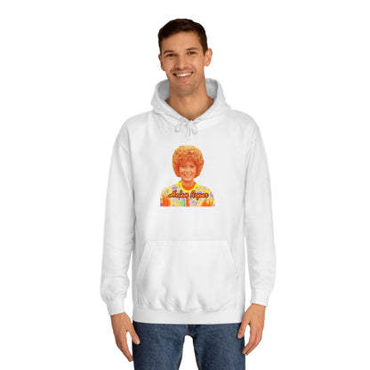 This Helen Roper - Three's Company unisex hoodie by Printify features a lively graphic of a woman with curly hair in a vibrant, patterned outfit. The elegantly scripted text "Mother Rogers" beneath her adds a vintage fashion flair to any wardrobe.