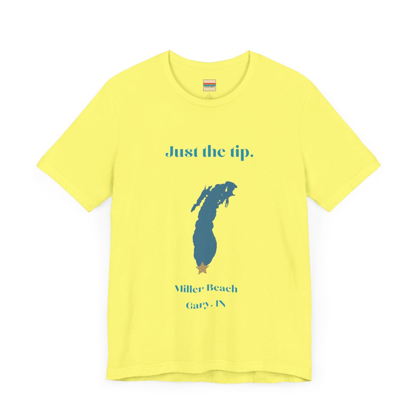 The Just the Tip - Miller Beach Unisex Jersey Short Sleeve Tee by Printify in yellow showcases text and a graphic design. The top displays "Just the tip" above a blue silhouette reminiscent of Indiana. At the bottom, it reads "Miller Beach" and "Gary, IN." Made from soft Airlume combed cotton, this tee offers both comfort and style.