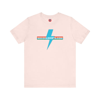 This unisex jersey short sleeve tee by Printify features a striking maroon color with a central light blue lightning bolt design. The text "SOCOOLSHIRTS.COM" is prominently displayed across the lightning bolt in white letters, set against a multicolored background that exudes retro vibes. The shirt is shown laid flat on a white backdrop.