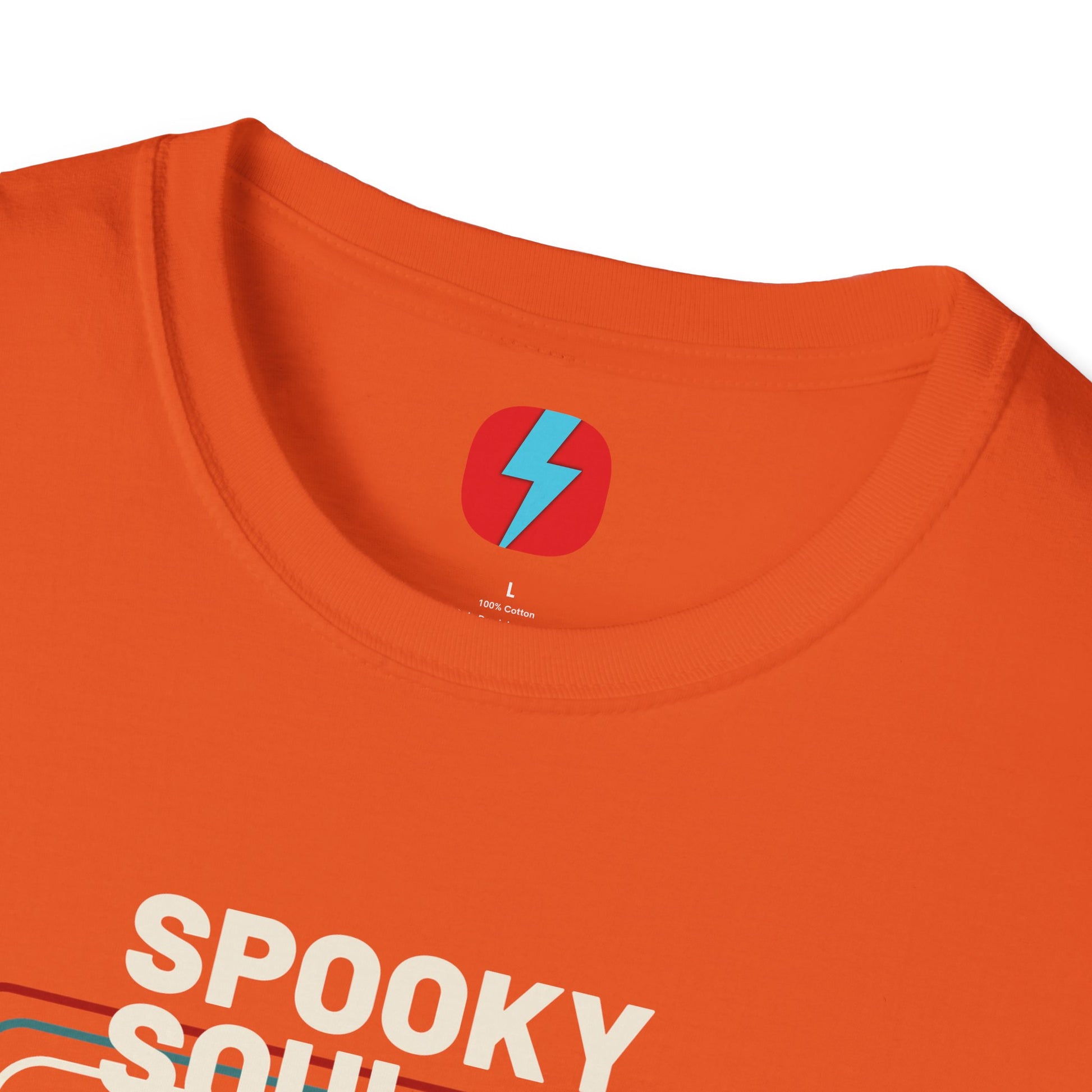 The Spooky Soul - Halloween - Unisex Softstyle T-Shirt by Printify, available in dark gray, showcases a retro-style graphic of a mummy dancing with two kids in Halloween costumes. The text "SPOOKY SOUL" is displayed above the image, which is framed by red and blue lines to enhance its vintage feel.