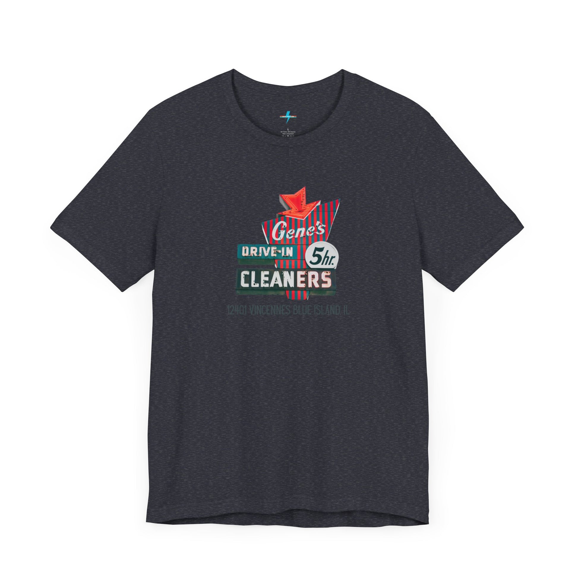 A unisex Jersey short sleeve tee from Printify featuring a light grey color with a retro-style graphic in the center. The design showcases text that reads "Gene's Drive In Cleaners, 5th," along with the address "12401 Vincennes Blue Island IL" in a blend of vintage fonts and colors, evoking the classic Chicago Fire-era vintage sign aesthetic.