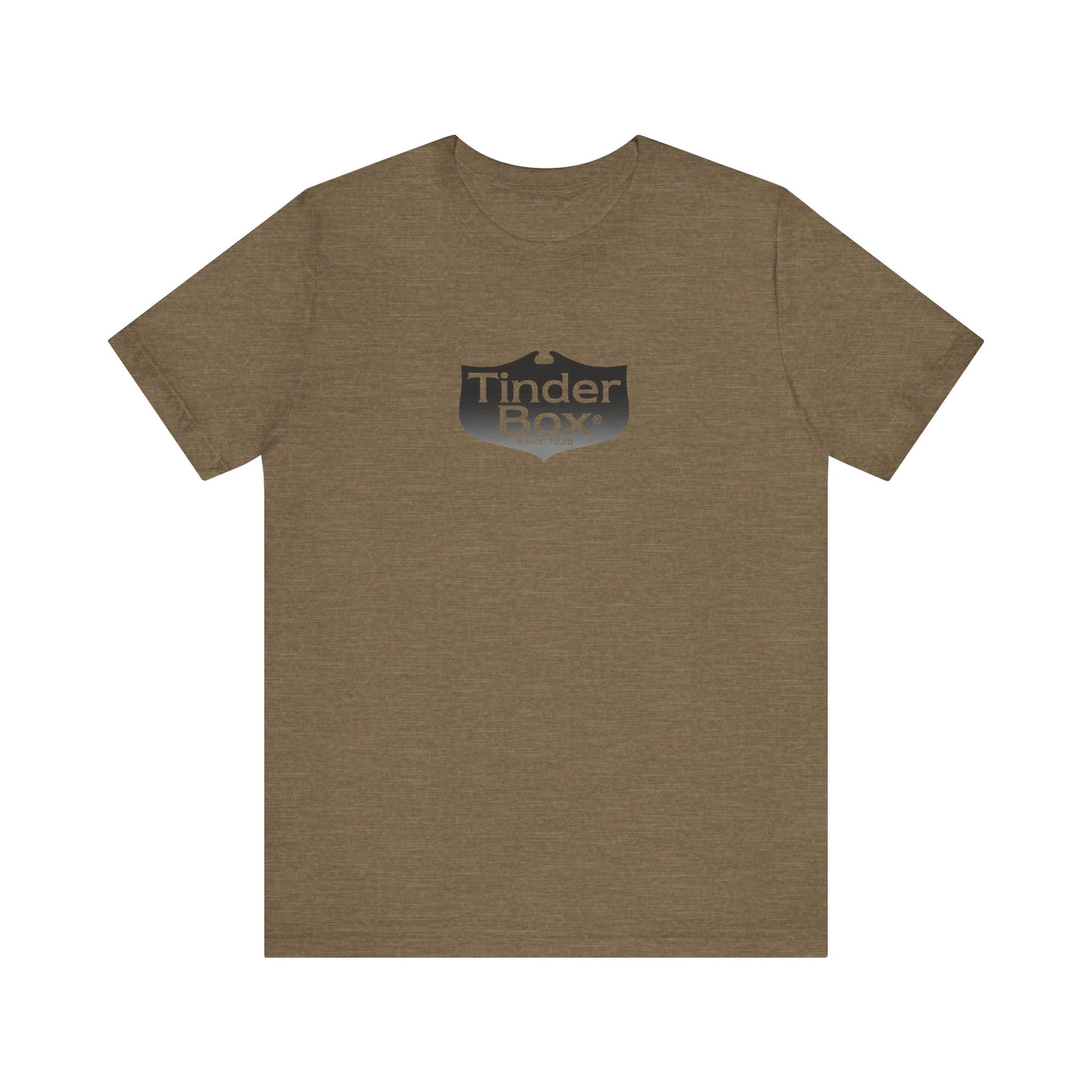 A light blue Printify "The Tinder Box 1980s" unisex jersey short sleeve tee featuring the "Tinder Box" logo in the center. The logo consists of a dark shield with the words "Tinder Box" in white text, with a small flame icon replacing the dot above the "i".