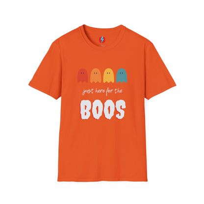 The "Just Here for the Boos - Halloween - Unisex Softstyle T-Shirt" by Printify is a blue, unisex tee with a playful Halloween theme. It features four ghost icons in red, orange, yellow, and green, followed by the text "just here for the BOOS" with "BOOS" styled in a bold and spooky font. Perfect for embracing the spooky season!