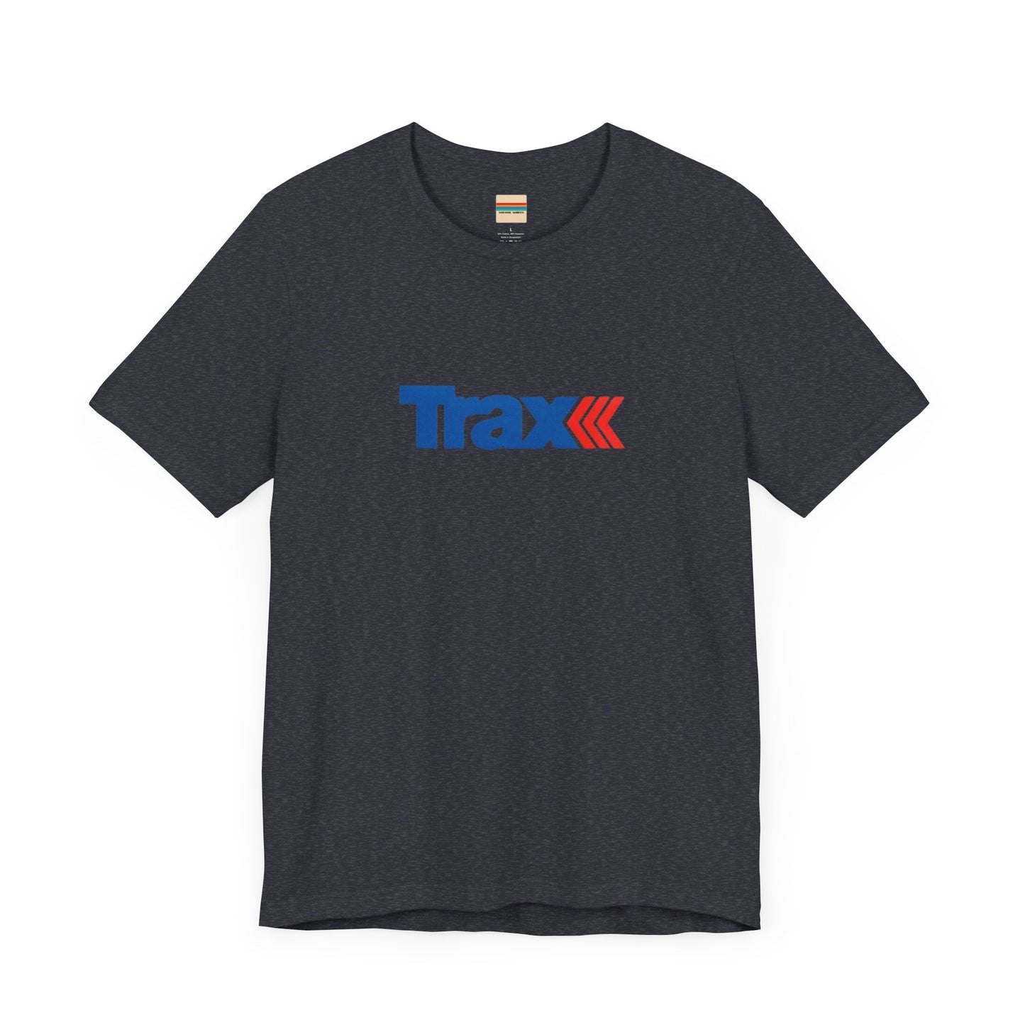 A gray unisex jersey short sleeve tee from Printify, inspired by retro 1980s Kmart style. The "Trax" logo is printed in blue letters, followed by three red arrows pointing to the right. This classic Trax Brand T-shirt is laid flat against a white background, capturing nostalgic fashion vibes.