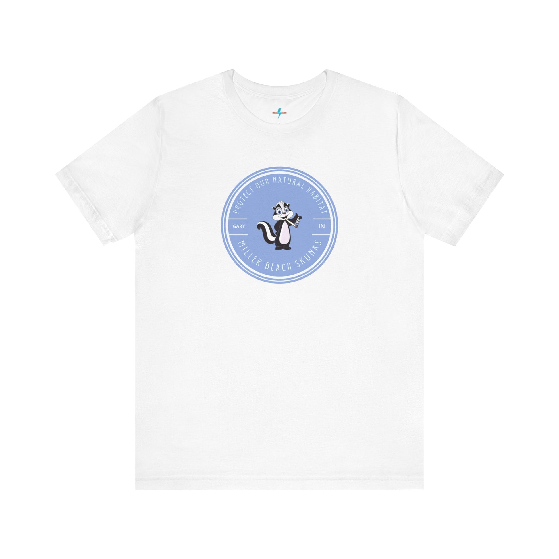 The Printify Miller Beach Skunks - Unisex Jersey Short Sleeve Tee is a gray T-shirt that features a circular blue logo at the center. Inside the logo, there is an illustration of a skunk with the text "Protect Our Habitat" and "Miller Beach Skunks" around the border, promoting environmental consciousness. The upper left part of the logo reads "Gary, IN.