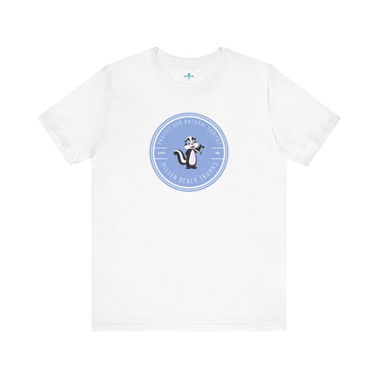 The Printify Miller Beach Skunks - Unisex Jersey Short Sleeve Tee is a gray T-shirt that features a circular blue logo at the center. Inside the logo, there is an illustration of a skunk with the text "Protect Our Habitat" and "Miller Beach Skunks" around the border, promoting environmental consciousness. The upper left part of the logo reads "Gary, IN.