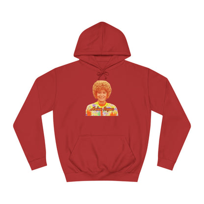 This Helen Roper - Three's Company unisex hoodie by Printify features a lively graphic of a woman with curly hair in a vibrant, patterned outfit. The elegantly scripted text "Mother Rogers" beneath her adds a vintage fashion flair to any wardrobe.