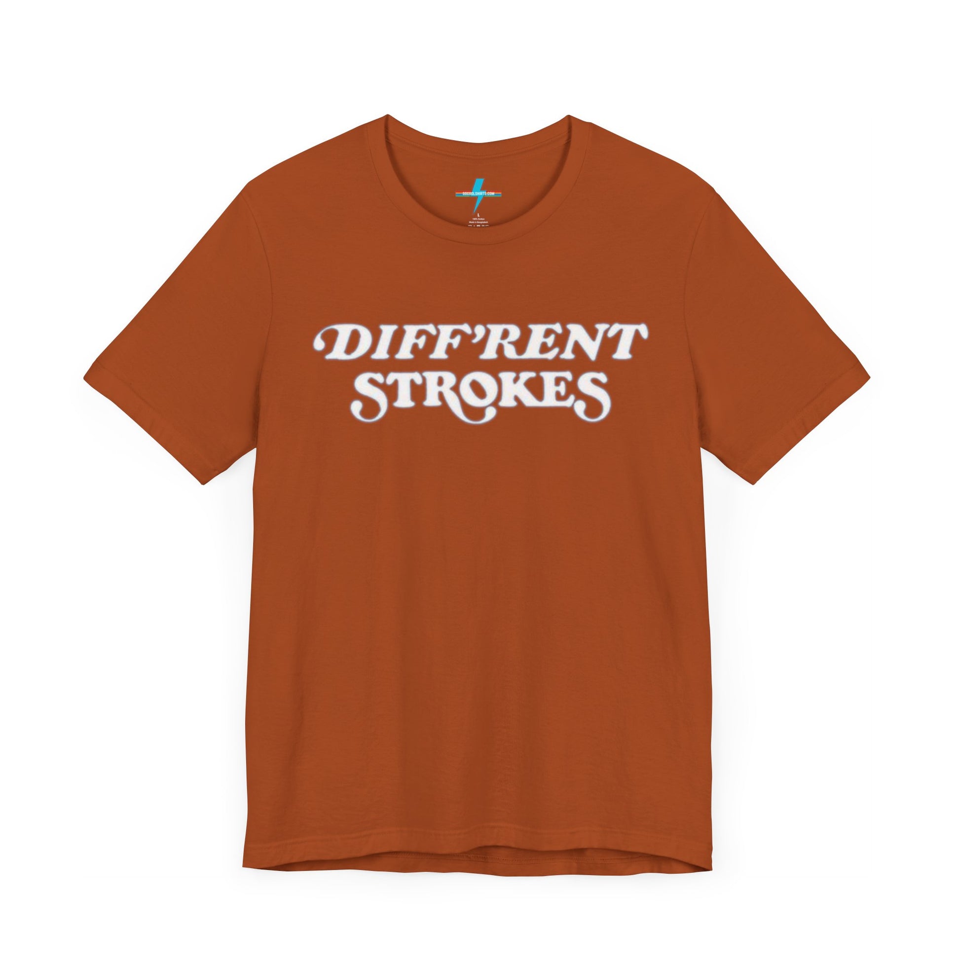 A burnt orange "Diff’Rent Strokes - Retro 1980s" unisex jersey short sleeve tee by Printify, featuring the phrase "DIFF'RENT STROKES" in bold, white cursive letters across the chest. The plain white backdrop perfectly showcases this nostalgic TV apparel.