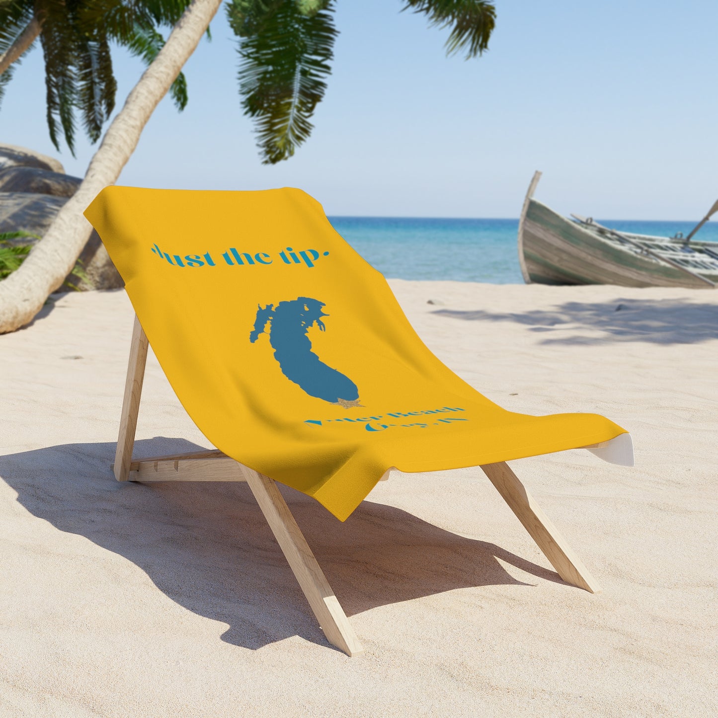 The Printify "Just the Tip - Miller Beach" towel is luxuriously soft and brightly yellow, featuring a blue silhouette of a woman's head with long hair adorned with a crown-like star. The sides are printed in blue with the text "Just the Tip" and "Miller Beach Gary, IN.