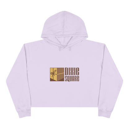 Pink cropped hoodie from Printify, showcasing a yellow and brown "Dixie Square" logo with a ribbon design on the front, reminiscent of the iconic Dixie Square Mall in Harvey, IL from the Blues Brothers era.