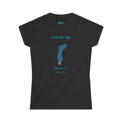 The Printify Just the Tip - Miller Beach Women's Softstyle Tee, crafted from high-quality tri-blend fabric, showcases a light blue color with a stylized wave graphic alongside the text "Just the tip. Miller Beach, Gary, IN." This tee is both casual and stylish, making it an ideal choice to express your beachside spirit.