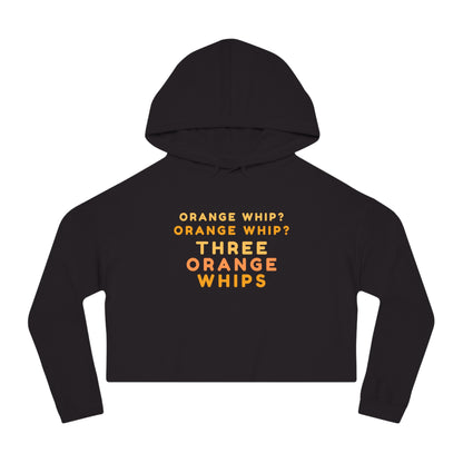 A stylish and comfortable Black Camo cropped hooded sweatshirt from Printify, this "Three Orange Whips - Blues Brothers" women's hoodie features the iconic text "Orange Whip? Orange Whip? Orange Whip? THREE ORANGE WHIPS" in bright orange letters on the front. It includes a front pocket and drawstring-adjustable hood.