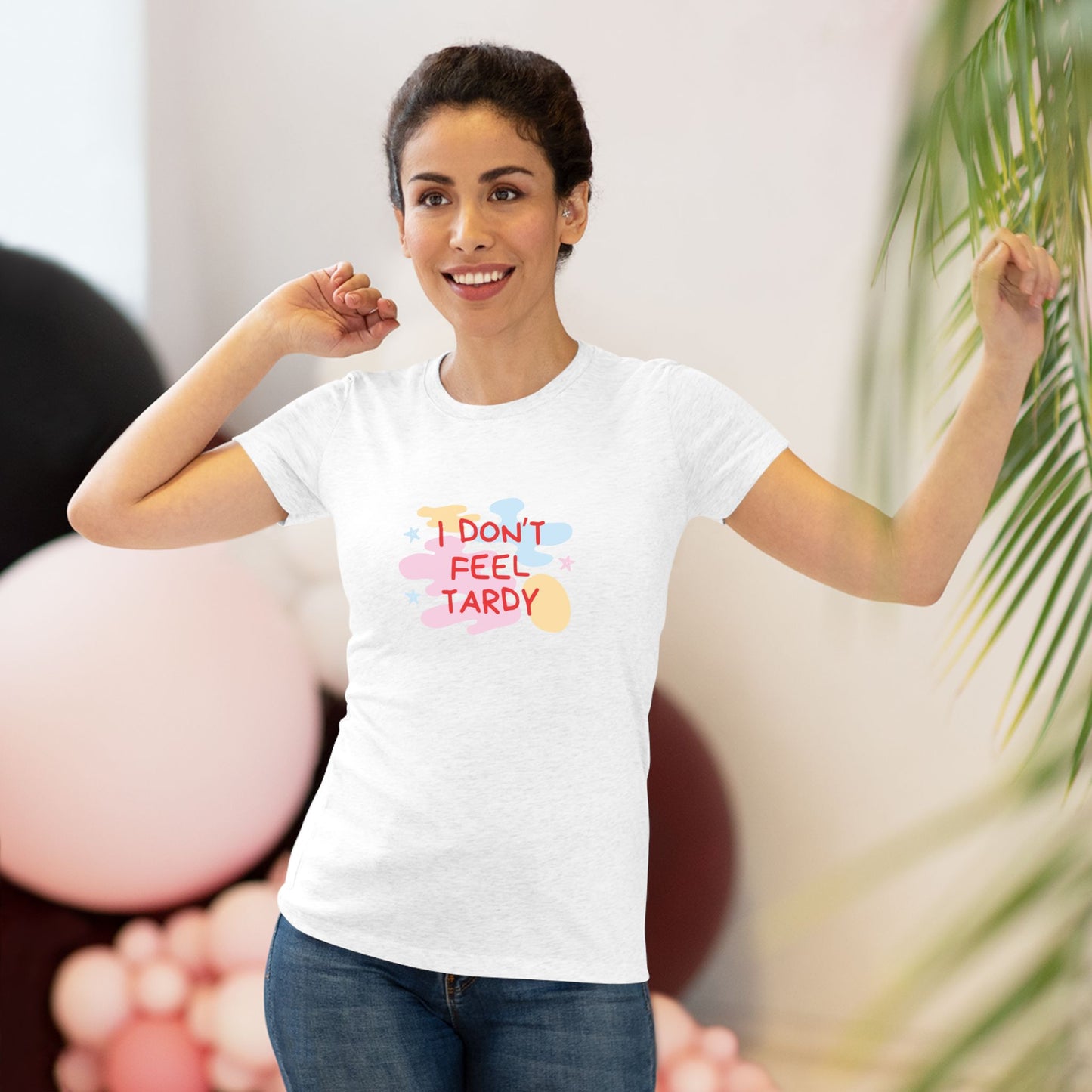 A light gray, short-sleeved Women's Triblend Tee from Printify with the playful phrase "I DON'T FEEL TARDY" printed in colorful letters on the front. The text is surrounded by abstract pastel shapes, giving it retro vibes and a vintage look reminiscent of a Van Halen T-shirt.