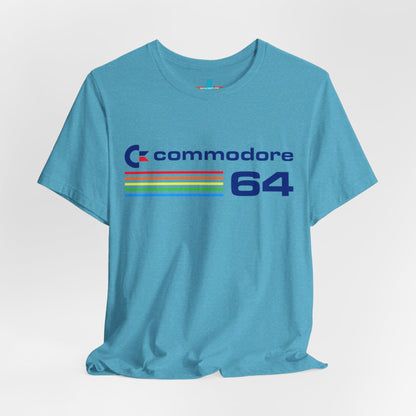 The 1980s Commodore 64 Computer C64 Unisex Jersey Short Sleeve Tee from Printify features a green T-shirt adorned with a vintage design showcasing the text "Commodore 64" and multicolored horizontal lines next to it. The word "Commodore" is emblazoned in blue alongside the Commodore logo, while the number "64" is also highlighted in blue on the right. Ideal for any retro tech enthusiast, this shirt is displayed against a white background.