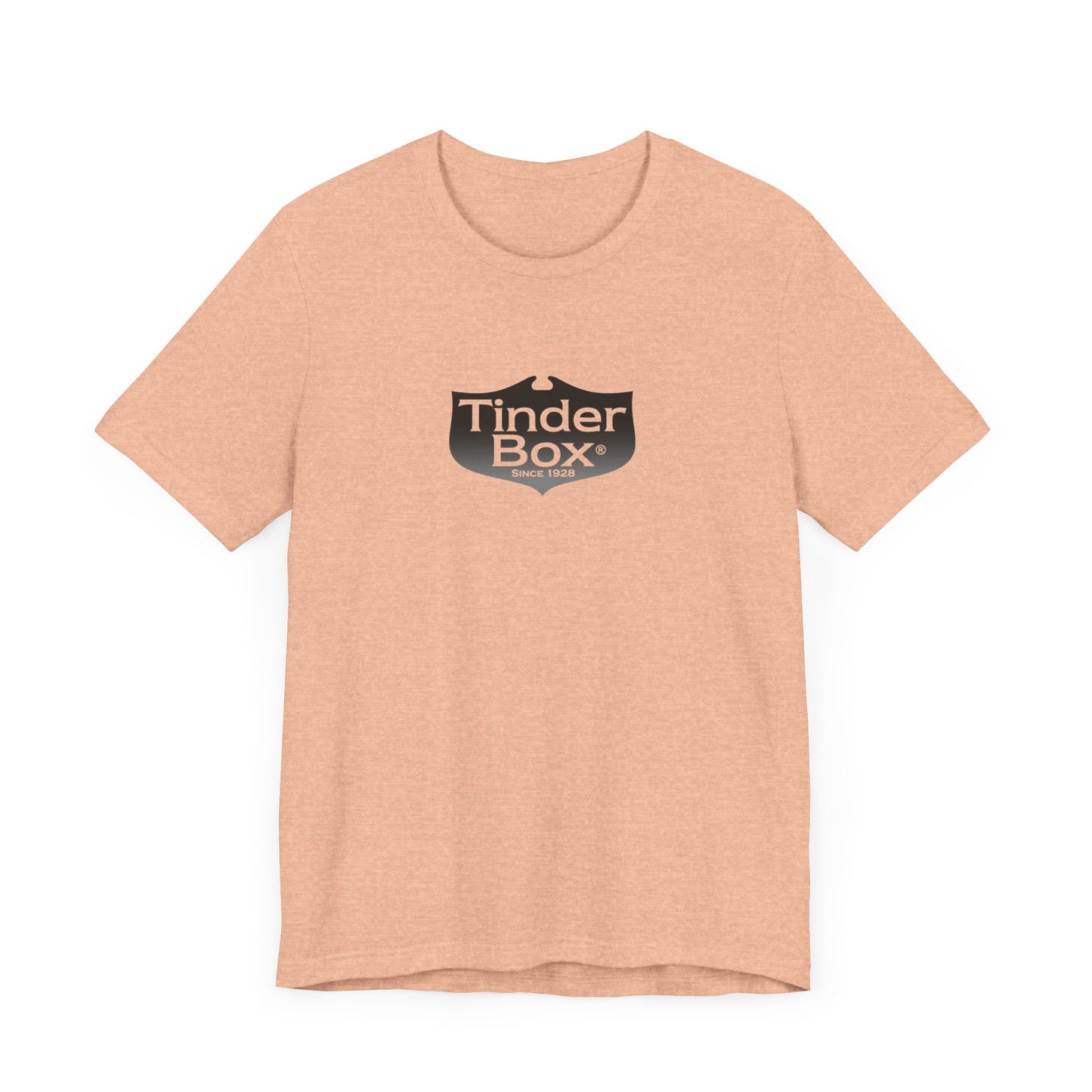 A light blue Printify "The Tinder Box 1980s" unisex jersey short sleeve tee featuring the "Tinder Box" logo in the center. The logo consists of a dark shield with the words "Tinder Box" in white text, with a small flame icon replacing the dot above the "i".