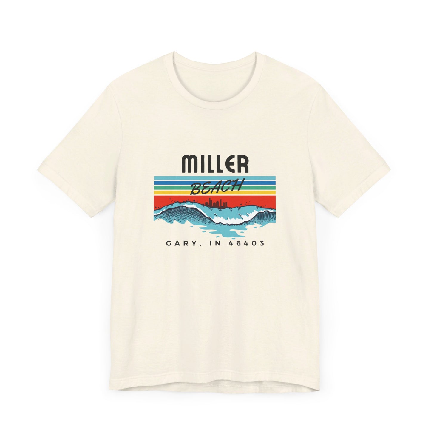 The Miller Beach 46403 Surf Style - Unisex Jersey Short Sleeve Tee by Printify features a retro surf-inspired design on a yellow background. The shirt displays "MILLER BEACH" above waves with a skyline illustration, while "Cary, IN 46403" is printed below the waves. The vibrant design also includes colorful stripes in shades of blue, red, and orange.