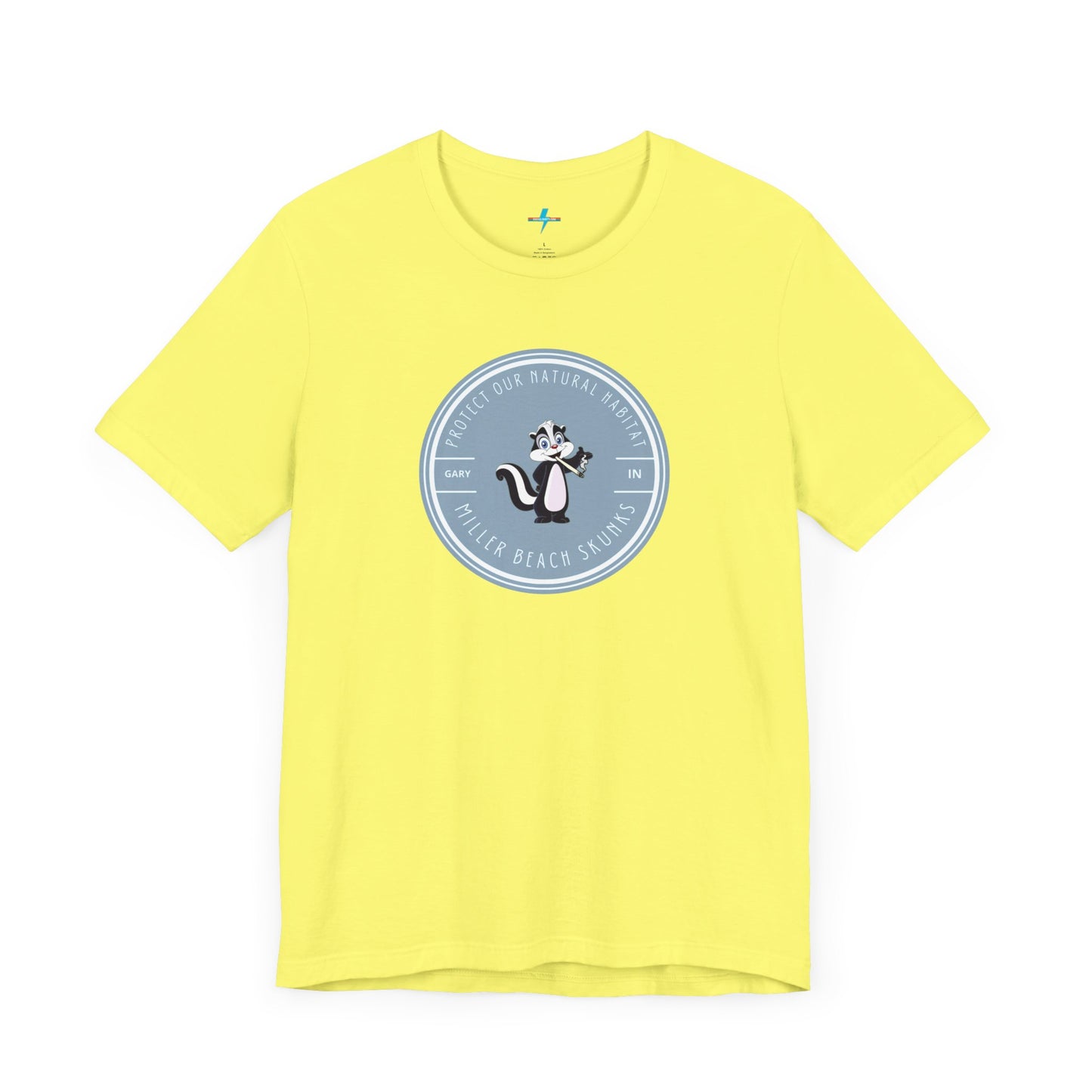 The Printify Miller Beach Skunks - Unisex Jersey Short Sleeve Tee is a gray T-shirt that features a circular blue logo at the center. Inside the logo, there is an illustration of a skunk with the text "Protect Our Habitat" and "Miller Beach Skunks" around the border, promoting environmental consciousness. The upper left part of the logo reads "Gary, IN.