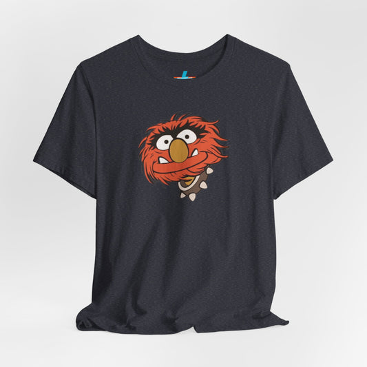 The Animal The Muppets 1980s Retro - Unisex Jersey Short Sleeve Tee by Printify is a high-quality fabric tee featuring a black background and a cartoon face of Animal from The Muppets. His wild red hair, big eyes, and yellow nose create a friendly expression that vividly pops against the T-shirt.