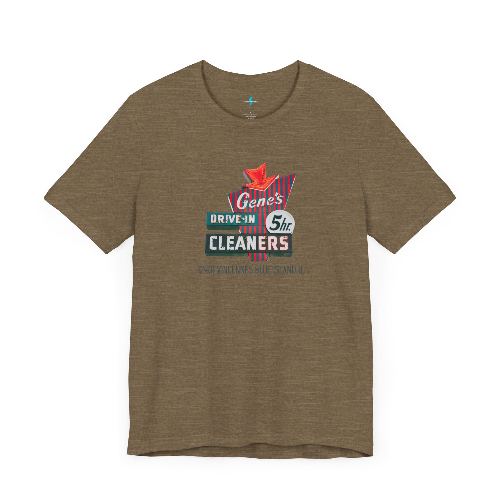 A unisex Jersey short sleeve tee from Printify featuring a light grey color with a retro-style graphic in the center. The design showcases text that reads "Gene's Drive In Cleaners, 5th," along with the address "12401 Vincennes Blue Island IL" in a blend of vintage fonts and colors, evoking the classic Chicago Fire-era vintage sign aesthetic.