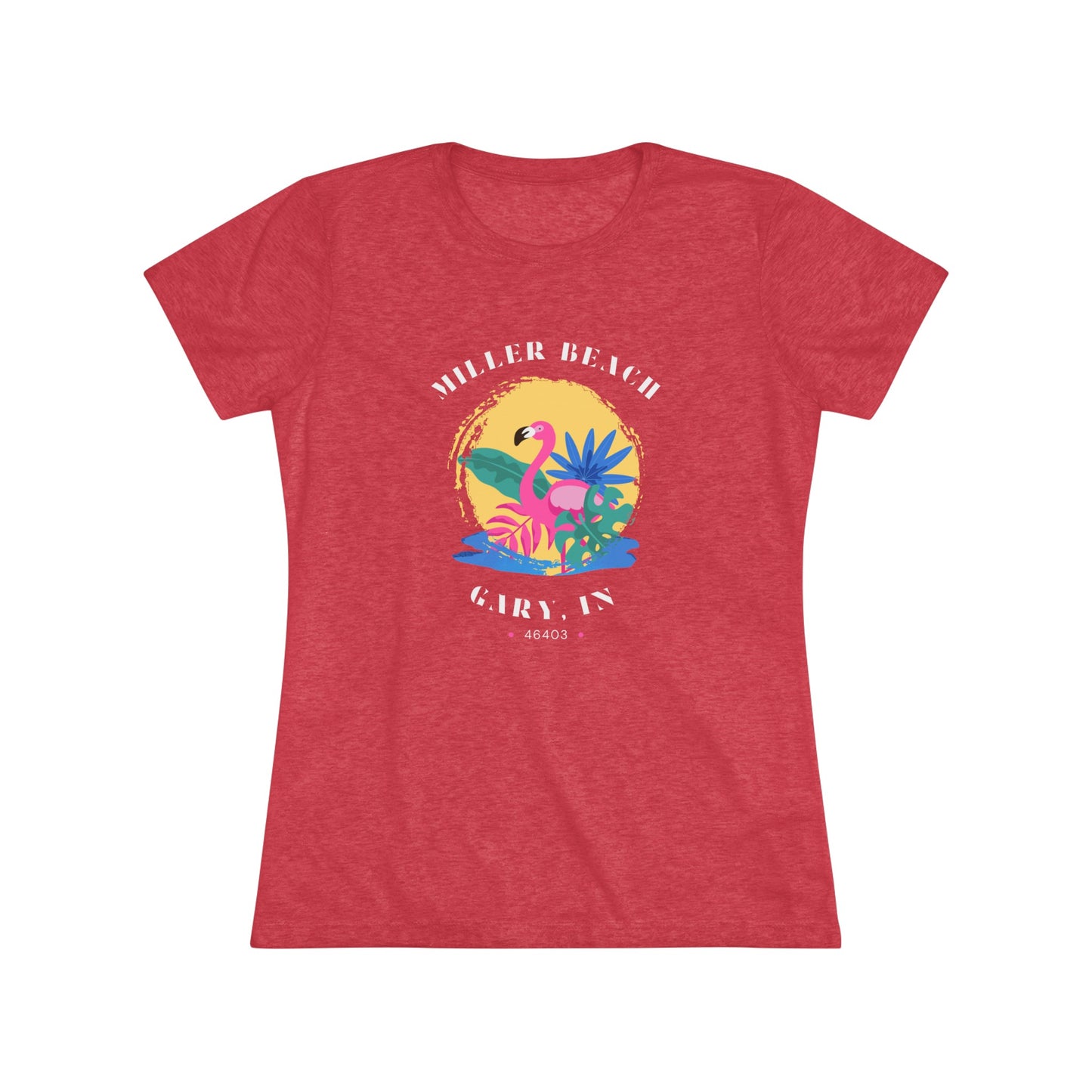 A women's triblend tee from Printify, the Miller Beach Flamingo features a blue color and "Miller Beach Gary, IN 46403" text with a vibrant design of a flamingo amidst tropical foliage for a vintage aesthetic. This t-shirt is showcased on a wooden surface alongside a denim jacket, white sneakers, and a potted plant.