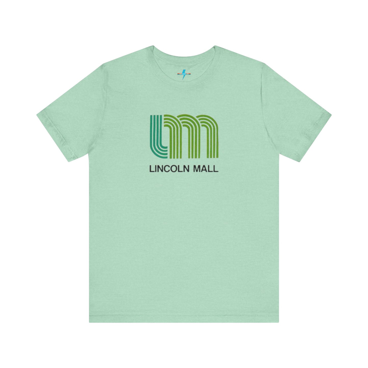 A light green unisex jersey short sleeve tee by Printify features "LINCOLN MALL" written under a retro-styled green and blue curved line design, celebrating the 70s and 80s shopping era in Lincoln Mall Matteson.