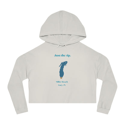 The "Just the Tip - Miller Beach - Women’s Cropped Hooded Sweatshirt" by Printify is designed in black camo with high-quality tri-blend fabric, showcasing a blue map shape and a yellow star. It features the phrase "Killer Beach" along with references to "Gary, IN," embodying the spirit of Miller Beach adventures.