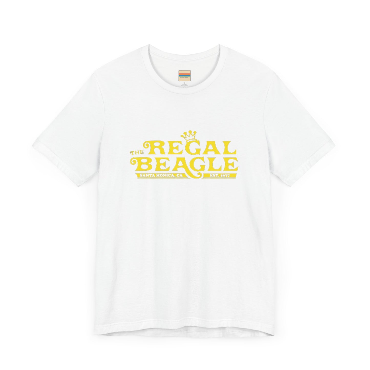 The Printify Regal Beagle - Three's Company Unisex Jersey Short Sleeve Tee, in black, showcases "The Regal Beagle, Santa Monica, CA, Est. 1977" text in a yellow vintage-style font. Crafted from 100% Airlume combed cotton for superior comfort.