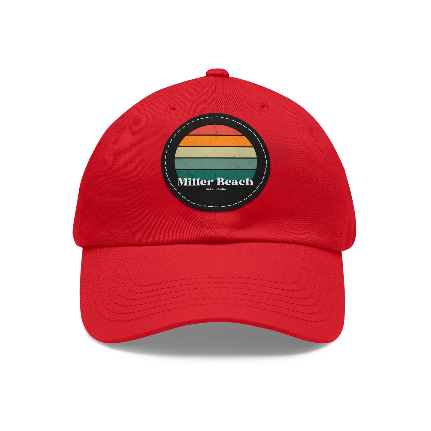 The Miller Beach Retro Sunset - Dad Hat with Leather Patch (Round) by Printify is a pink baseball cap crafted from bio-washed chino twill for added comfort. It features a PU leather patch adorned with horizontal stripes in red, orange, yellow, green, and blue. Below the stripes, "Miller Beach" is embroidered in white. An adjustable strap at the back ensures a perfect fit.