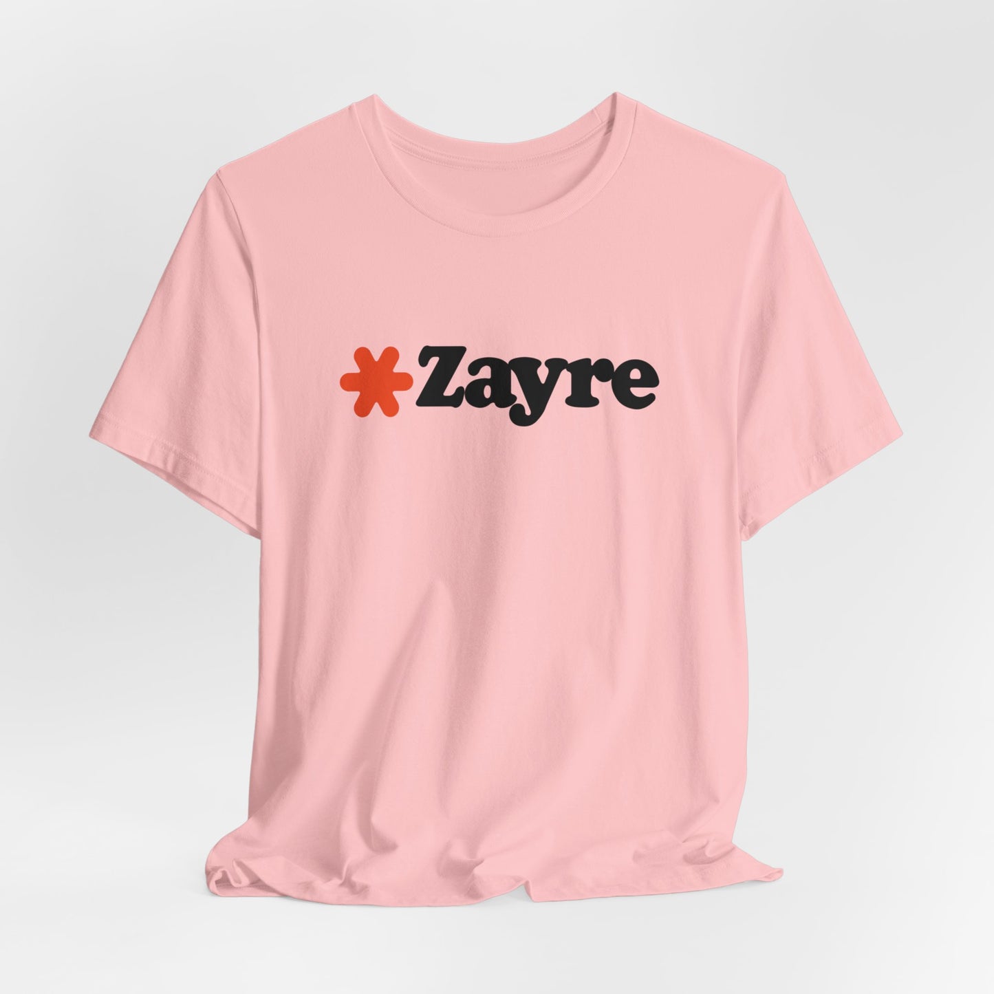 The Zayre Stores Logo - Retro 1980s Unisex Jersey Short Sleeve Tee by Printify features a gray design with the word "Zayre" printed in black letters and a red asterisk preceding the text. Reminiscent of retro fashion from the Zayre 1980s Retail Store, this shirt is displayed against a minimalistic white background and appears to be made of soft, comfortable fabric.