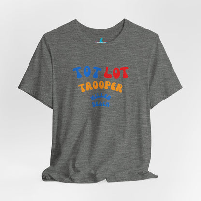 A green unisex jersey short sleeve tee from Printify, featuring colorful text on the front that reads "TOT LOT TROOPER MILLER BEACH" in blue, red, yellow, and orange letters. The shirt is displayed against a plain white background.