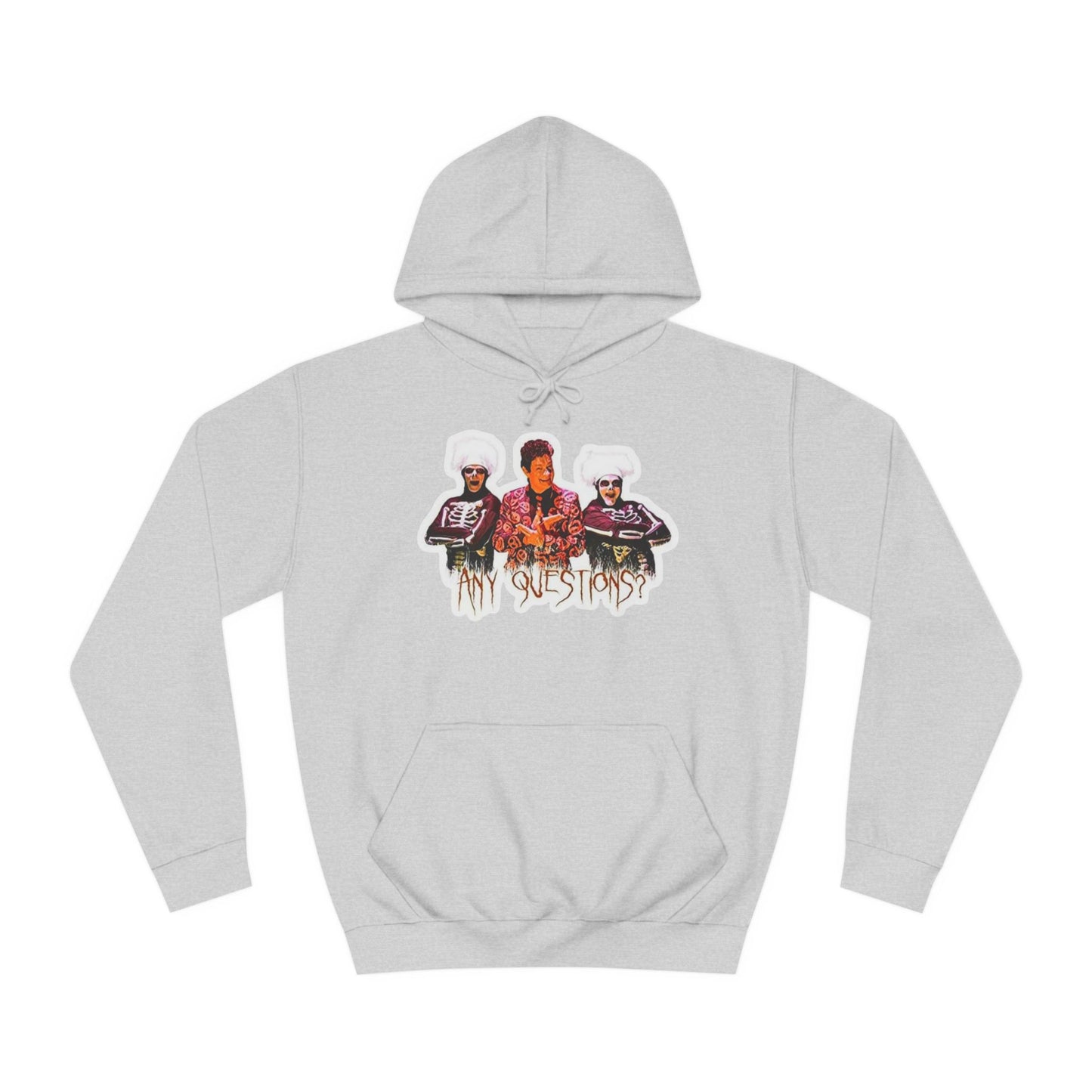 The David S Pumpkins - Any Questions? - Halloween Unisex College Hoodie by Printify is a brown sweatshirt showcasing an illustration of three people. The central figure has red hair, sports a colorful ensemble, and emanates a Halloween vibe, with two flanking figures who have white hair and wear dark attire. Beneath the trio is the phrase "Any Questions?