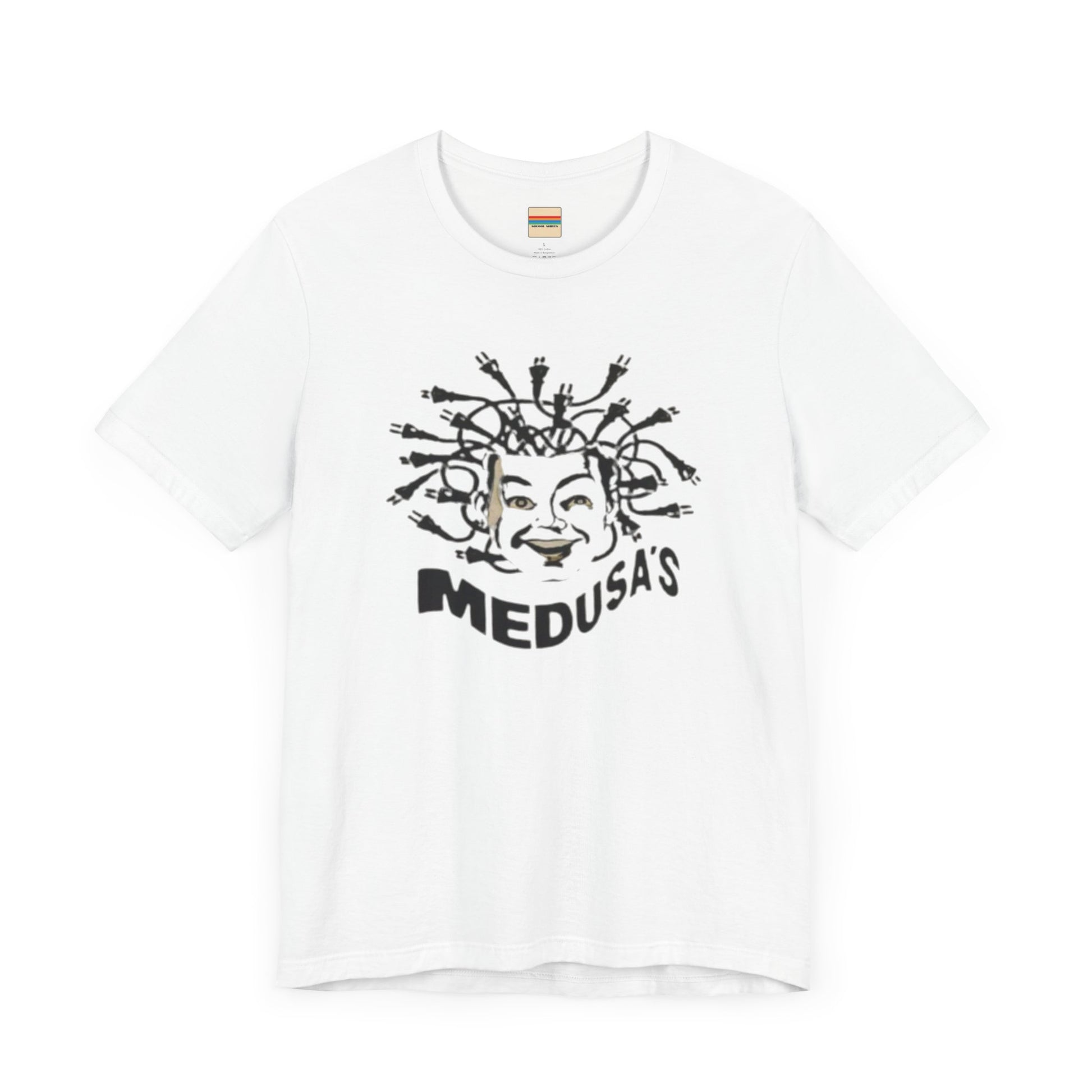 A cream-colored unisex jersey short sleeve tee from Printify, titled "Medusa's 1980s Dance Club Chicago," features a black and white illustration of a cartoonish Medusa head. The soft cotton design showcases numerous snakes as hair with a smiling face. Below, the word "MEDUSA'S" is printed in bold, playful font.