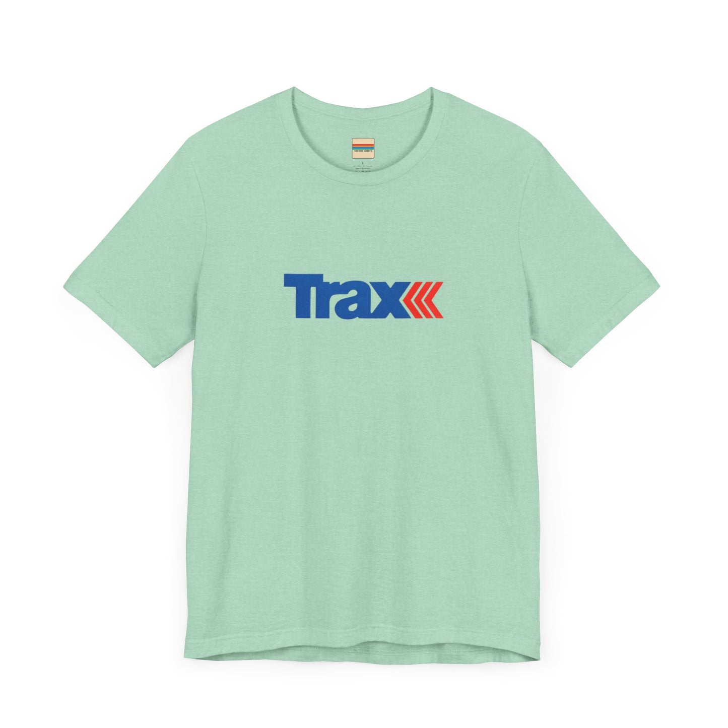 A gray unisex jersey short sleeve tee from Printify, inspired by retro 1980s Kmart style. The "Trax" logo is printed in blue letters, followed by three red arrows pointing to the right. This classic Trax Brand T-shirt is laid flat against a white background, capturing nostalgic fashion vibes.