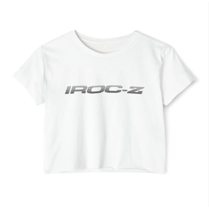 A grey, short-sleeve, rounded-neckline Women's Festival Crop Top by Printify, featuring "IROC-Z" printed in bold black letters across the chest. Perfect for any festival, this Chevrolet Iroc Z-inspired top from the 1980s stands out against a plain white background.