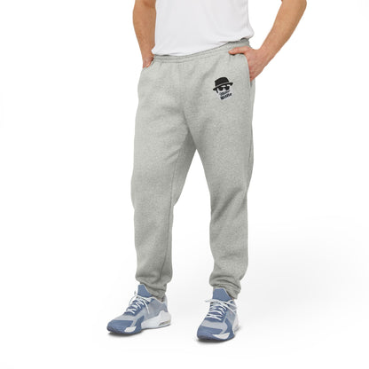 Introducing the Printify Miller Beach Wiffel Ball Blues Brothers Adidas Unisex Fleece Joggers: stylish gray sweatpants adorned with the iconic Adidas logo and a unique design of a stylized face wearing sunglasses and a hat on the left leg, crafted from sustainable materials under the Better Cotton Initiative.